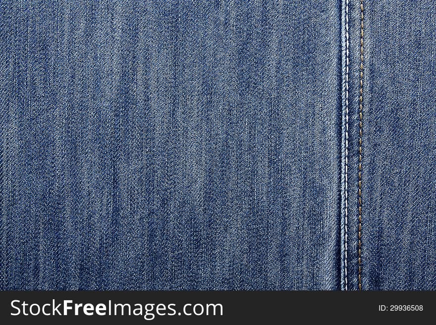 Blue jeans with yellow and white stitching