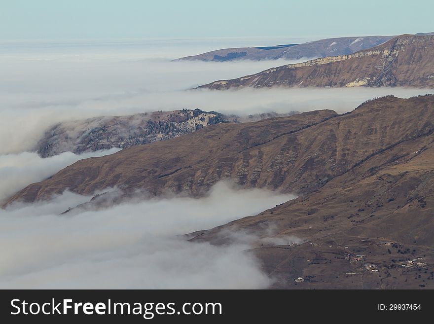 Winter mountains in the clouds