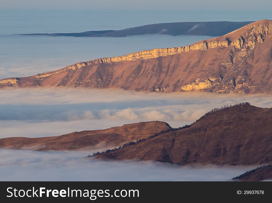 Winter mountains in the clouds