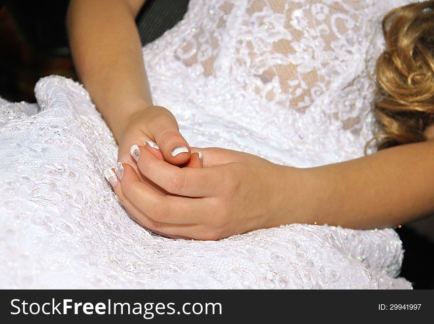 Wedding dress and the brides hands. Wedding dress and the brides hands