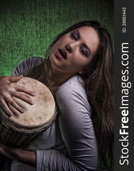 Beautiful Sexy Woman Playing Djembe Drum