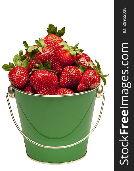 Beautiful close up of fresh ripe strawberries in a little pail. Isolated on a white background. Beautiful close up of fresh ripe strawberries in a little pail. Isolated on a white background.