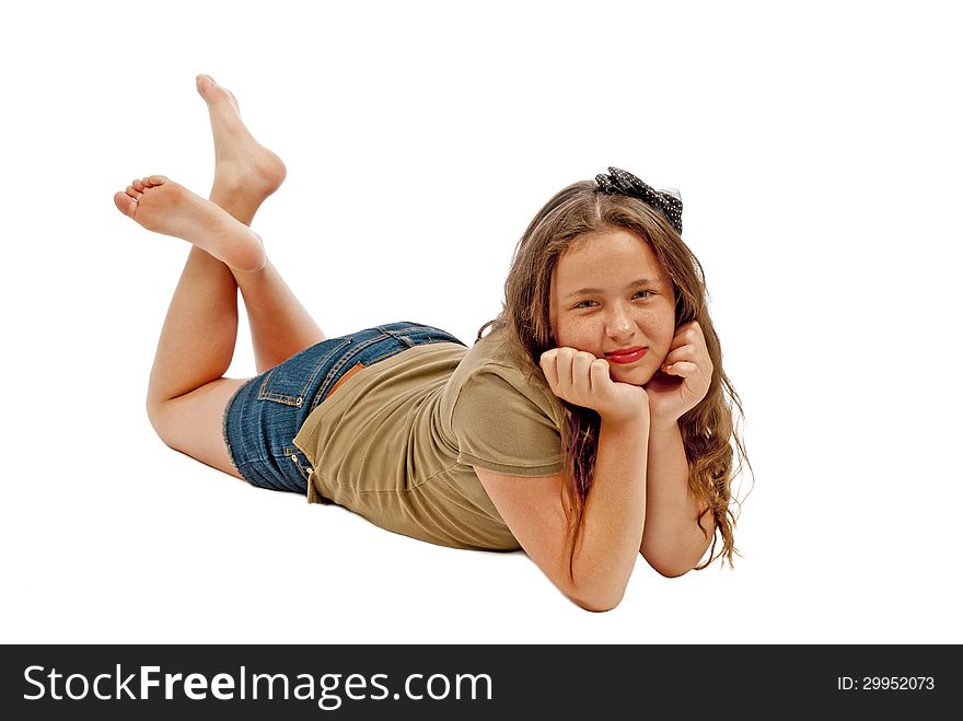Horizontal shot of a young teenage girl smiling and posing for the camera on a white background. Horizontal shot of a young teenage girl smiling and posing for the camera on a white background.