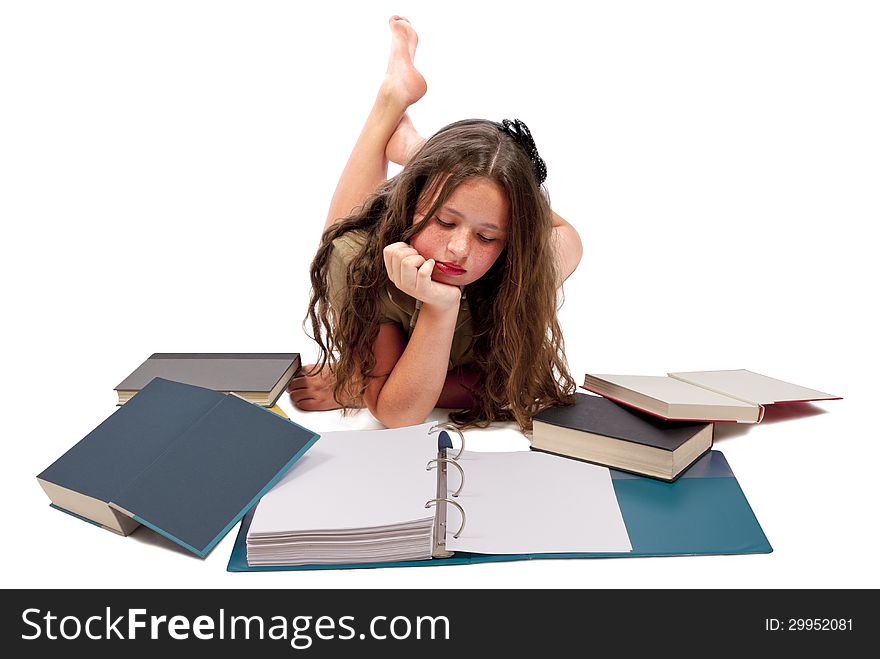 Horizontal shot of a girl reading or looking down at a notebook with other books scattered about. Isolated on a white background. Copy space on the blank pages. Horizontal shot of a girl reading or looking down at a notebook with other books scattered about. Isolated on a white background. Copy space on the blank pages.