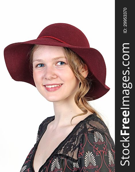 Portrait of a young blonde attractive girl in red hat isolated over white background. Portrait of a young blonde attractive girl in red hat isolated over white background