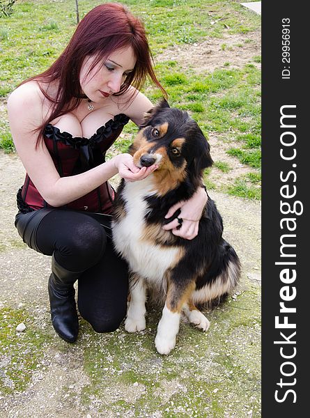 Young Woman With Australian Shepherd Dog