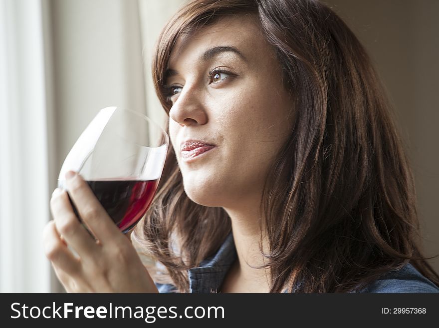Young Woman in Lingerie Drinking Red Wine