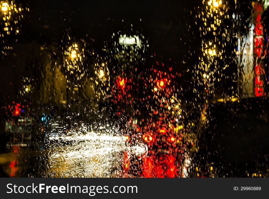 Rain and the lights at a Traffic Signal. Rain and the lights at a Traffic Signal.