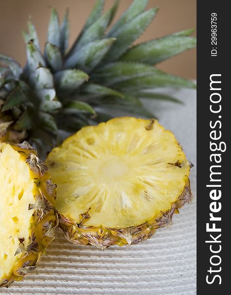 Close up piece of pineapple with leaves of pineapple head