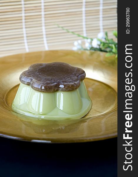 Green tea pudding on golden plate
