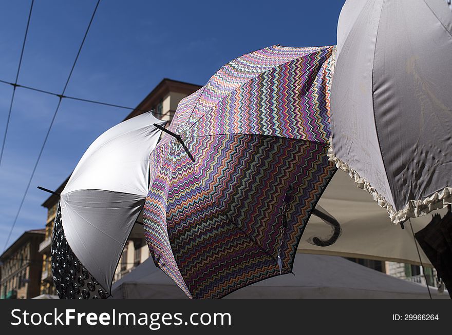 Some colored umbrella at market