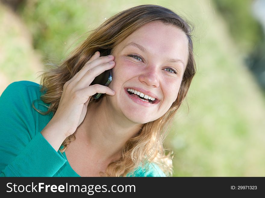 Portrait of a girl talking on the phone