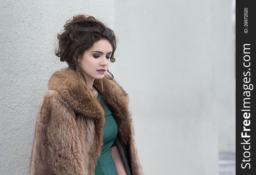 Elegance. Charming Autumn Brunette In Fur Coat In Her Thoughts