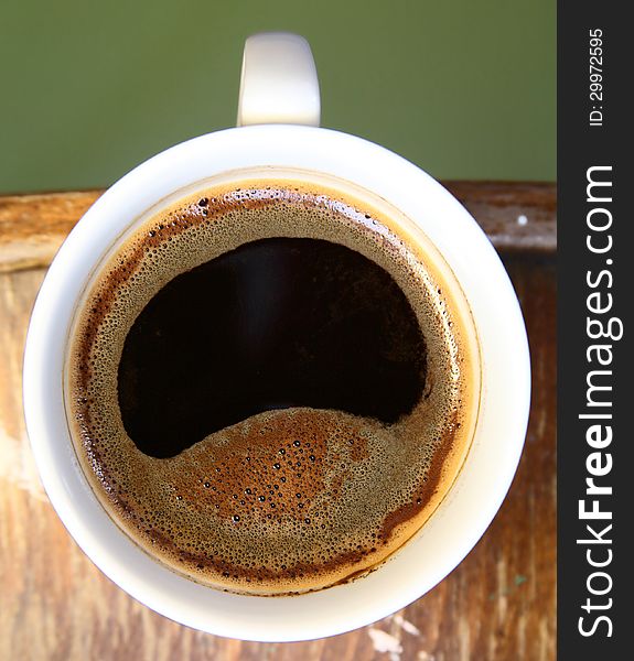 Close-up image of white cup of coffee