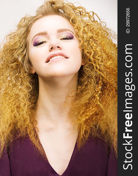 Youth. Beauty Portrait Of Frizzy Red Hair Woman Closeup. Pretty Smile