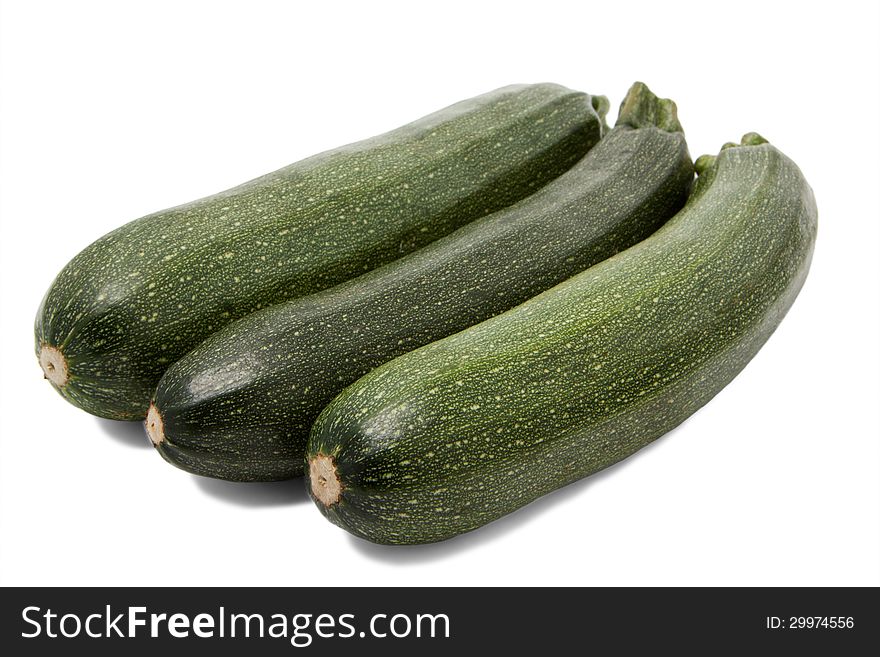 Three zucchini on white background