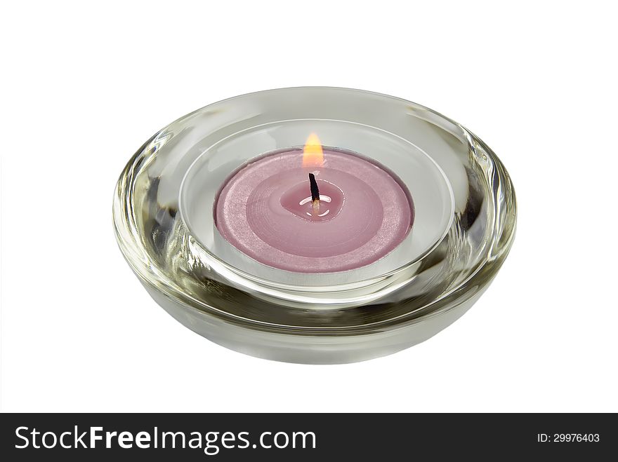 A candle in a glass holder.Isolated on white.