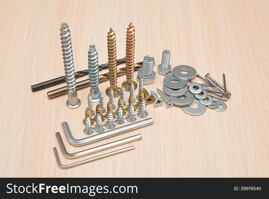 Different screws washers bolts and nails. Different screws washers bolts and nails