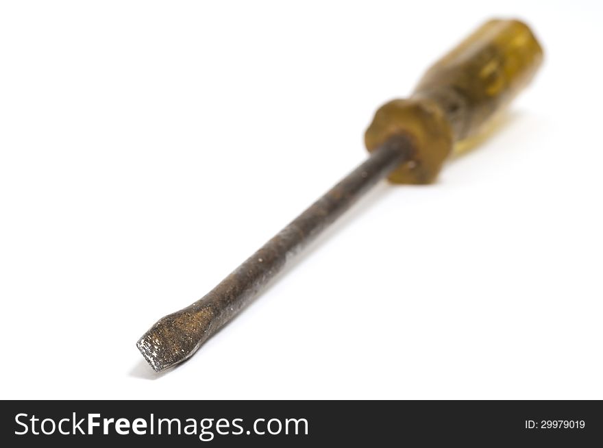 Selective focus on the end of an old screwdriver isolated on a white background