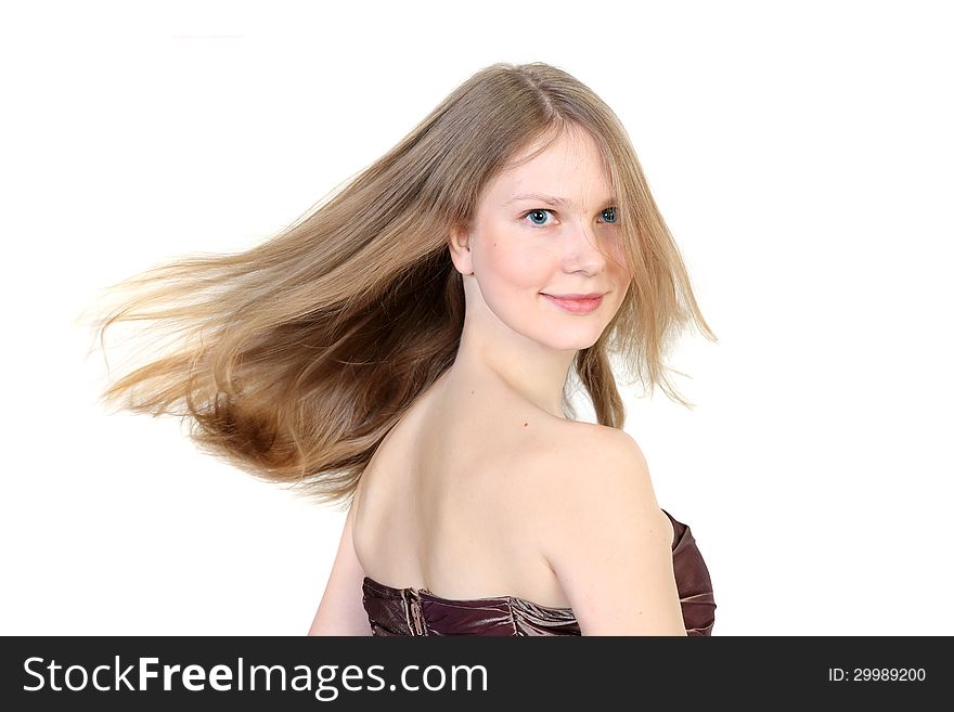 Portrait of a beautiful blonde with flying hair. lsolated on white background