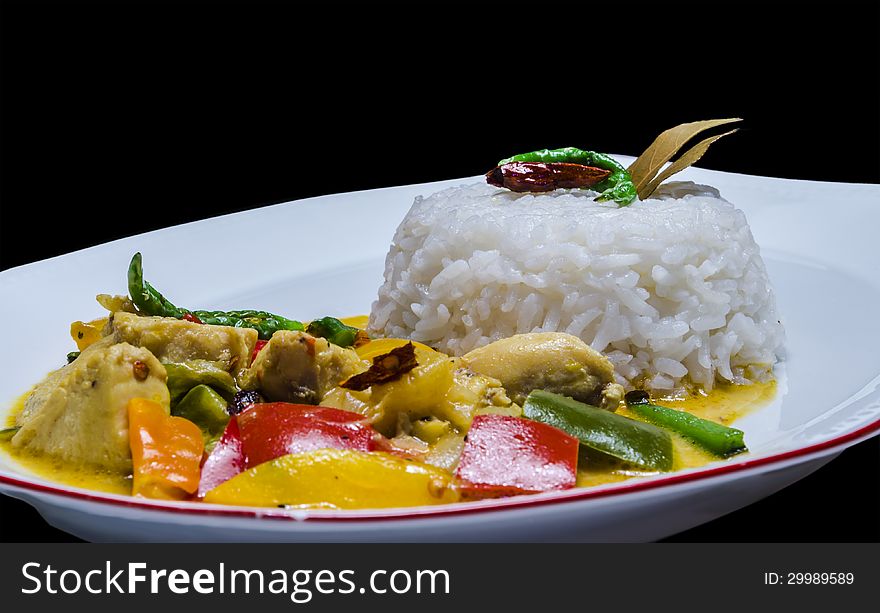 Yellow Thai chicken curry served with Jasmine rice. Yellow Thai chicken curry served with Jasmine rice.