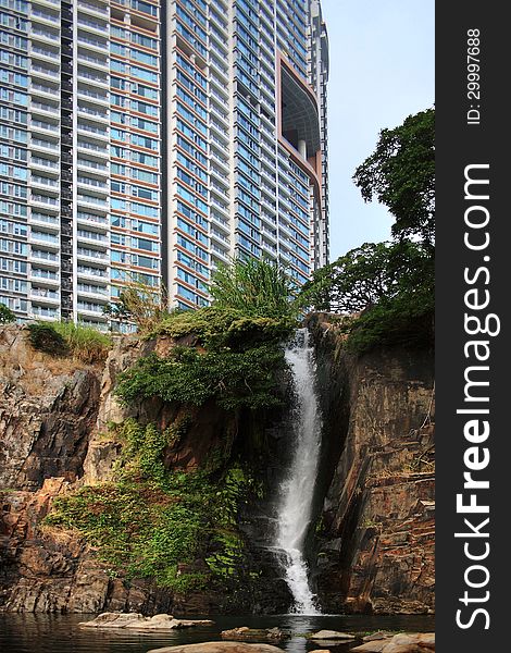 The architecture and nature, skyscrapers and waterfalls are located side by side on Hong Kong Island.