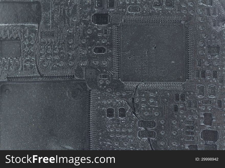 Printed circuit imprint in black plasticine background, concept of obsolete electronic, view like fossil. Printed circuit imprint in black plasticine background, concept of obsolete electronic, view like fossil