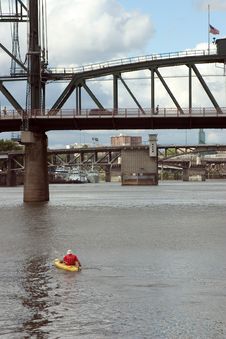 Man Kayaking Under Bridges Royalty Free Stock Photography Man Kayaking Under Bridges Royalty Free Stock Photography