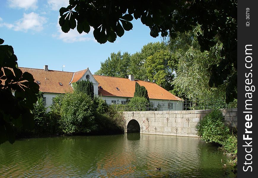 bridge leading to a water castle. bridge leading to a water castle