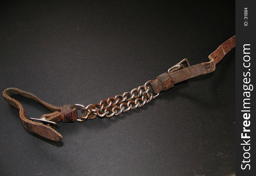 A used western curb chain for a western style bridle. A used western curb chain for a western style bridle.