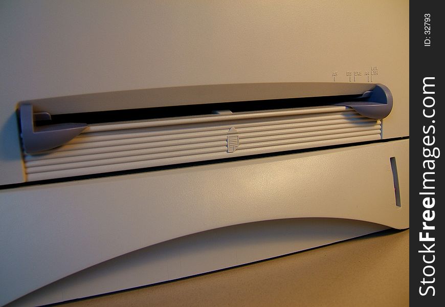 Close up detail view of copier/fax envelope feeder. Soft light from desk lamp. Close up detail view of copier/fax envelope feeder. Soft light from desk lamp.