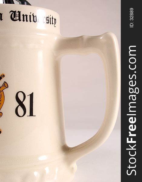 College Mug detail showing handle, part of the year and the word university. Mug is ceramic