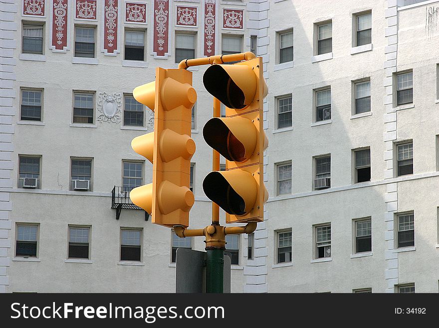 Traffic light with apartment in the back ground