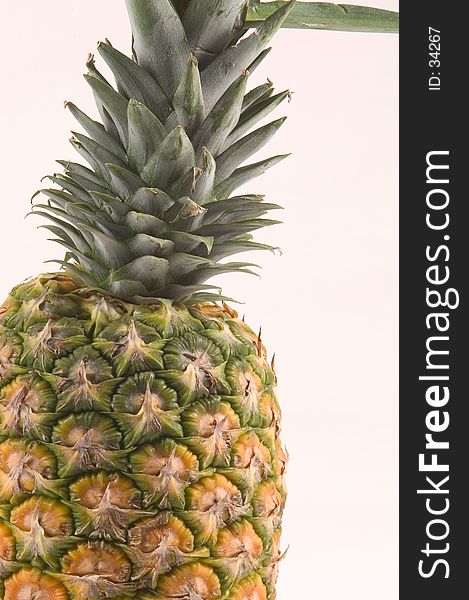 Close up view of a pineapple on a white background. Close up view of a pineapple on a white background