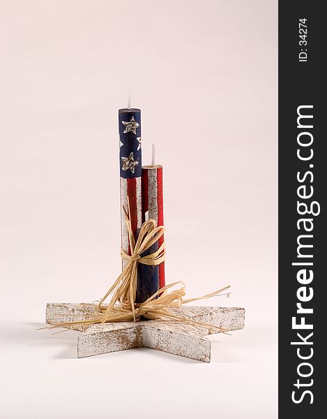 Wooden candles decorated with flag motif. wooden candles are mounted on a wooden star. Wooden candles decorated with flag motif. wooden candles are mounted on a wooden star