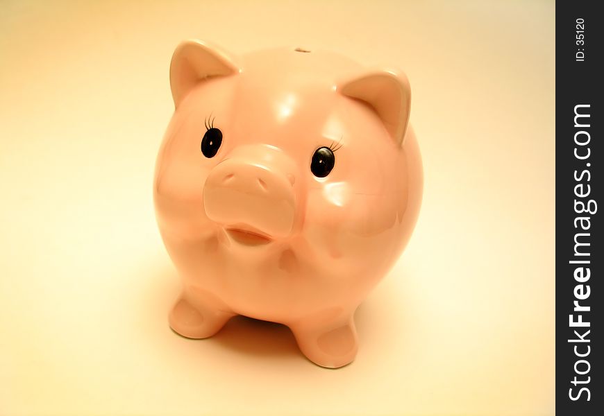 A cute pink piggy bank.