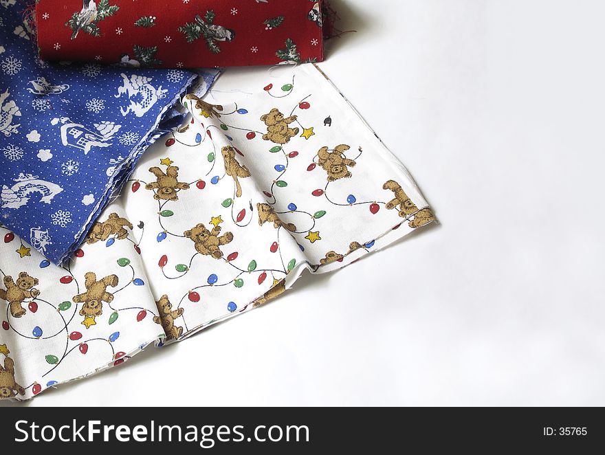 Christmas patterned fabrics on a white background. Christmas patterned fabrics on a white background