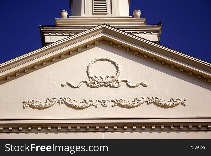 Closeup of church details against a blue sky background