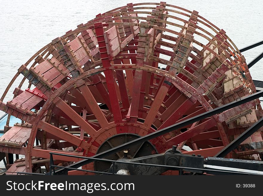 Large red paddle wheel on a river boat in Portland, Oregon. Large red paddle wheel on a river boat in Portland, Oregon.