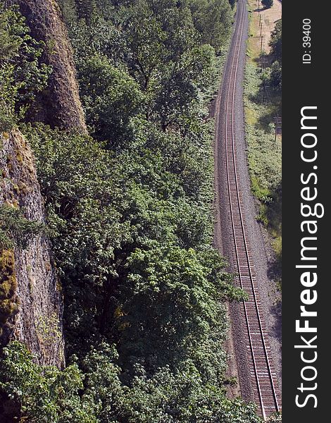 Railroad tracks running past a cliff in the Columbia River Gorge, Oregon. Railroad tracks running past a cliff in the Columbia River Gorge, Oregon.