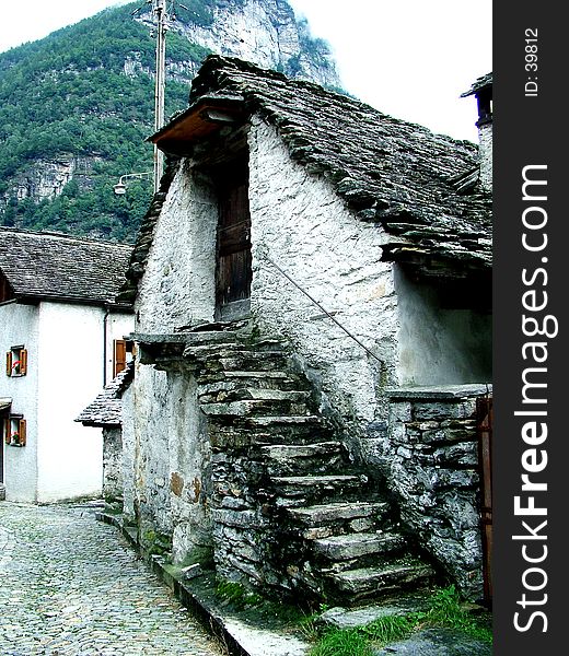 Digital photo of a house with a self-supporting stairway. It is typical for the verzasca-valley in switzerland. The houses are build out of stone and the roofs are build out of granite. Digital photo of a house with a self-supporting stairway. It is typical for the verzasca-valley in switzerland. The houses are build out of stone and the roofs are build out of granite.