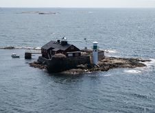 Small Island With Lighthouse Near Swedish Coast Royalty Free Stock Image Small Island With Lighthouse Near Swedish Coast Royalty Free Stock Image