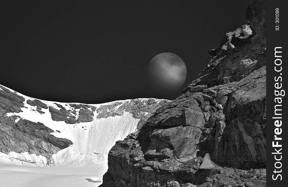 Moon rising over a mountain ridge. Moon rising over a mountain ridge