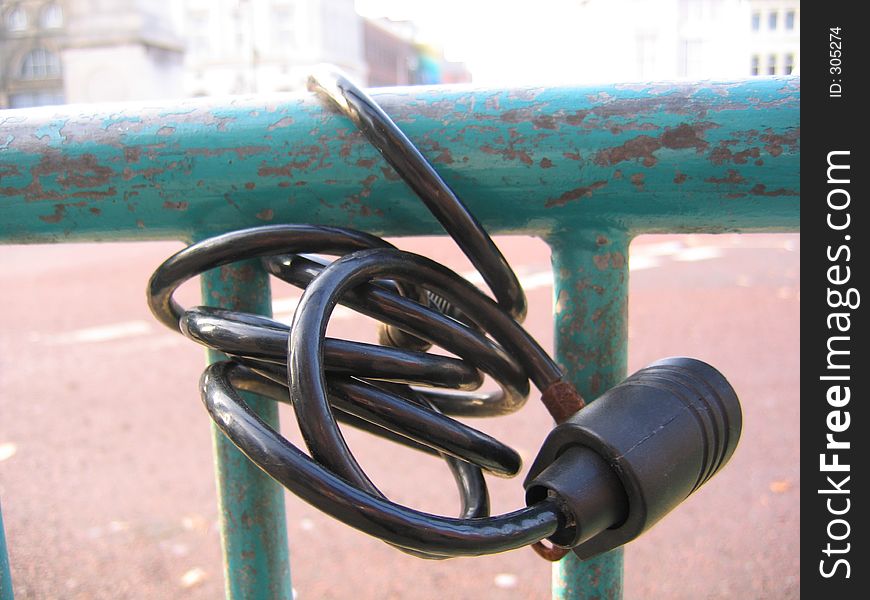 Bike Lock Abandoned on Railings. Bike Lock Abandoned on Railings