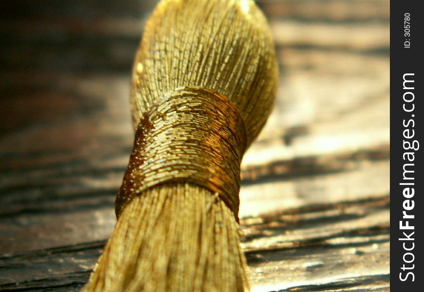 Golden knot on wood