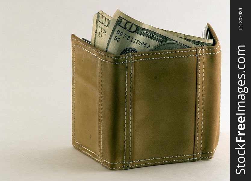 Money sticking out of a wallet. Money sticking out of a wallet