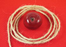 Red Apple And String Royalty Free Stock Image