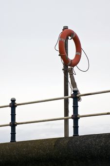 Lifebouy At Harbour Wall Stock Photo