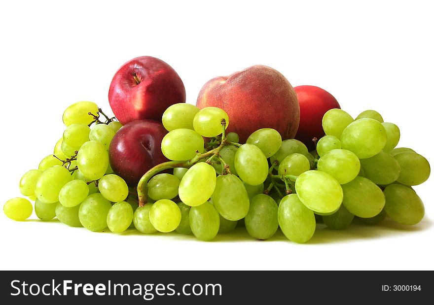 Many fruits on white background (peach, grapes, plume and apple)