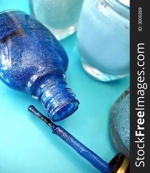 Nail polish on blue background